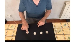 Coins Through The Table by Joaquin Matas